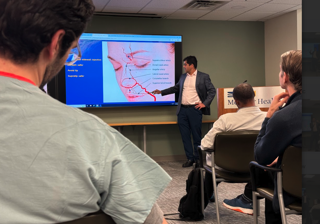Dr. Amir Bajoghli teaching facial anatomy and injection safety to physicians